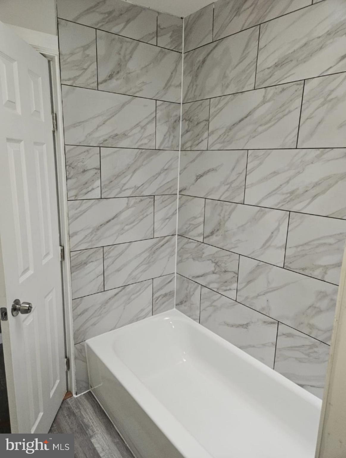5554 Crowson Street Philadelphia, PA 19144 - Photo 8 of 11 a bathroom with a white bathtub
