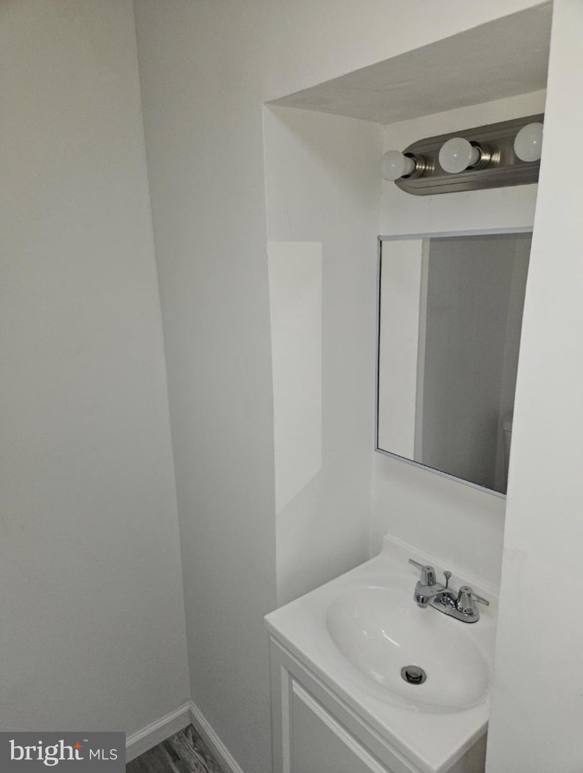 5554 Crowson Street Philadelphia, PA 19144 - Photo 9 of 11 a bathroom with a sink and mirror