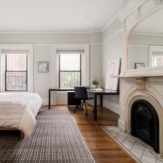 a view of a livingroom with furniture and a fireplace