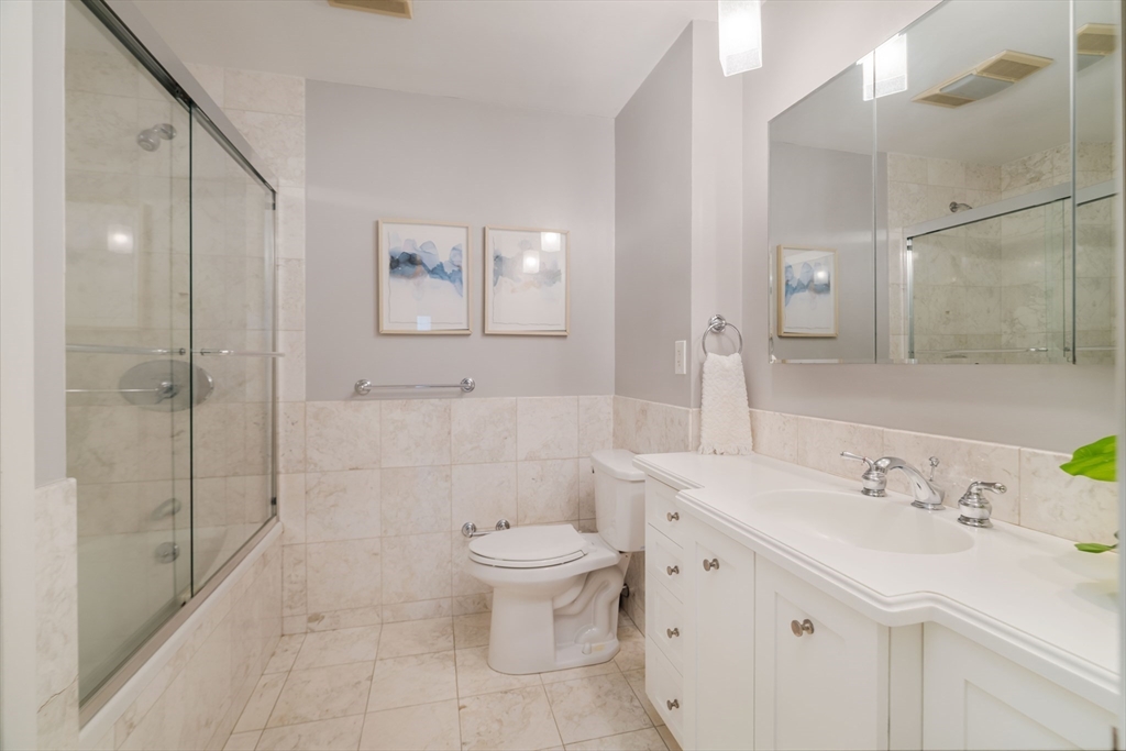 530 Massachusetts Avenue, Unit 2 Boston, MA 02118 - Photo 19 of 33 a bathroom with a sink toilet and shower