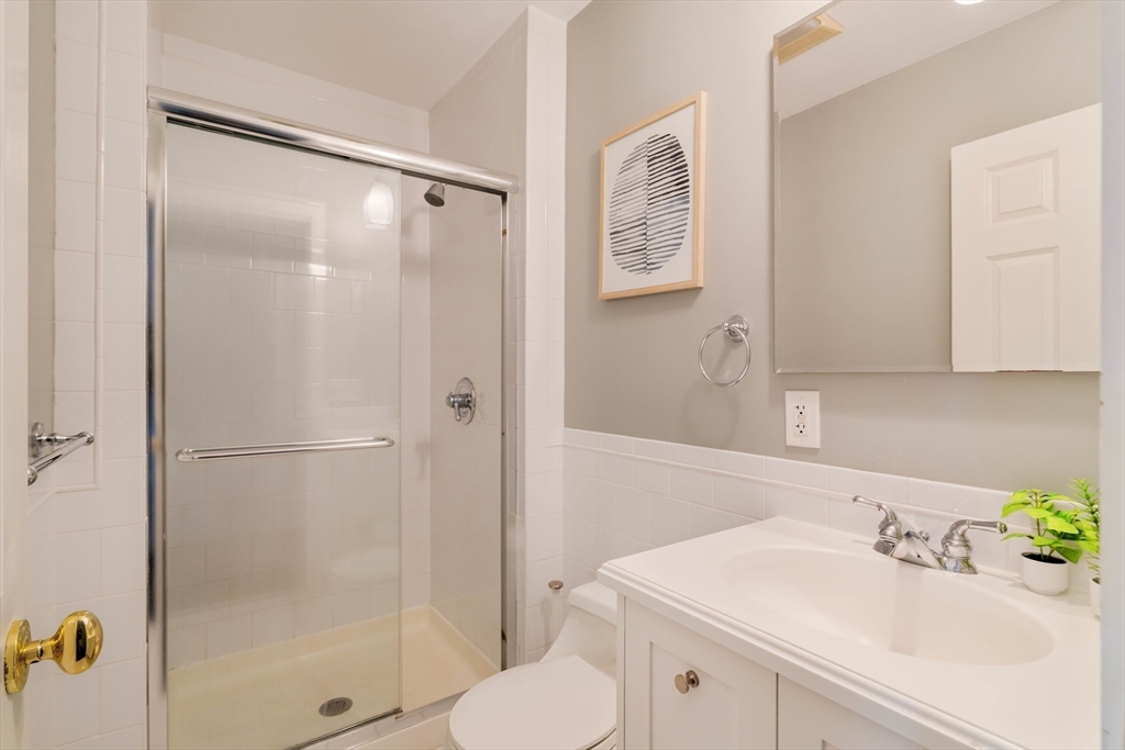 530 Massachusetts Avenue, Unit 2 Boston, MA 02118 - Photo 24 of 33 a bathroom with a sink toilet and shower