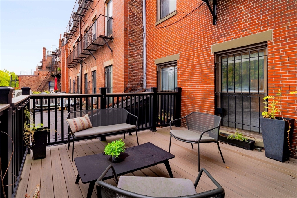 530 Massachusetts Avenue, Unit 2 Boston, MA 02118 - Photo 27 of 33 a view of a chairs and table in the balcony
