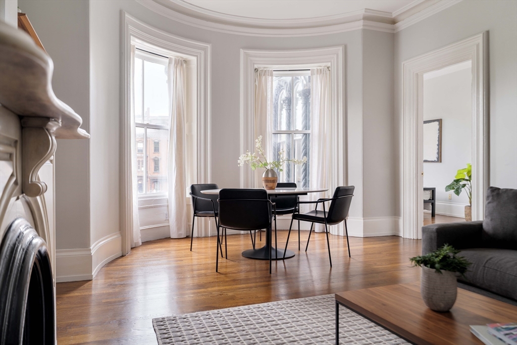530 Massachusetts Avenue, Unit 2 Boston, MA 02118 - Photo 3 of 33 a living room with fireplace furniture and a wooden floor