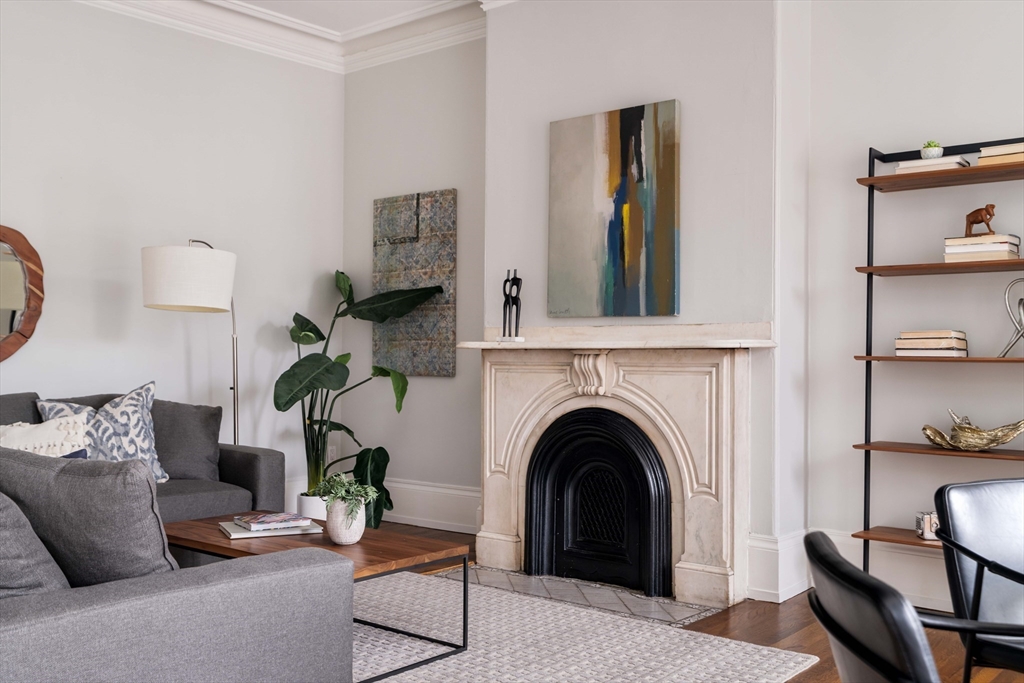 530 Massachusetts Avenue, Unit 2 Boston, MA 02118 - Photo 6 of 33 a living room with furniture and a fireplace