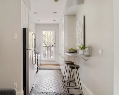 a view of a hallway with windows and couch