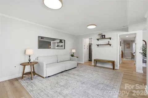 a living room with furniture and a table