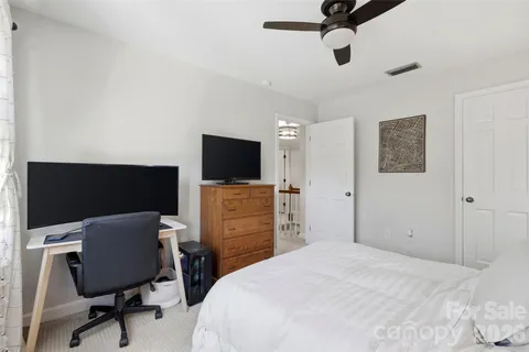 a bedroom with a workspace