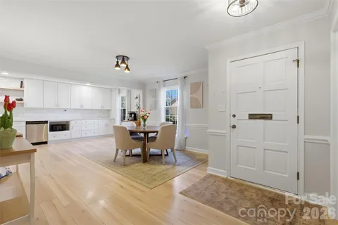 a view of kitchen with furniture and natural light