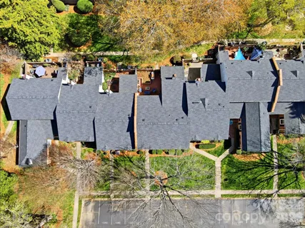 an aerial view of multiple houses with outdoor space