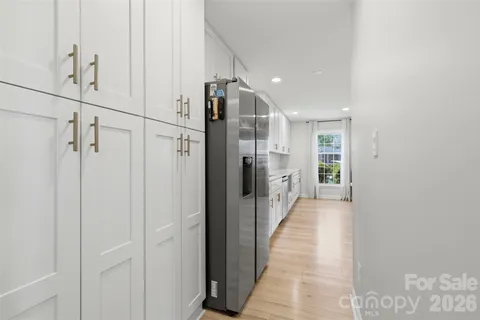 a view of a hallway with a dining area