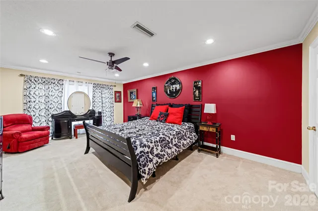 a bed room with a bed and dresser