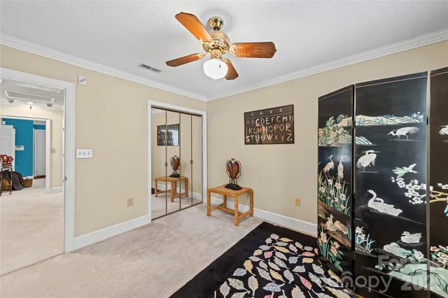 a bedroom with furniture and window