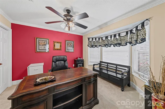 a view of a livingroom with furniture and window