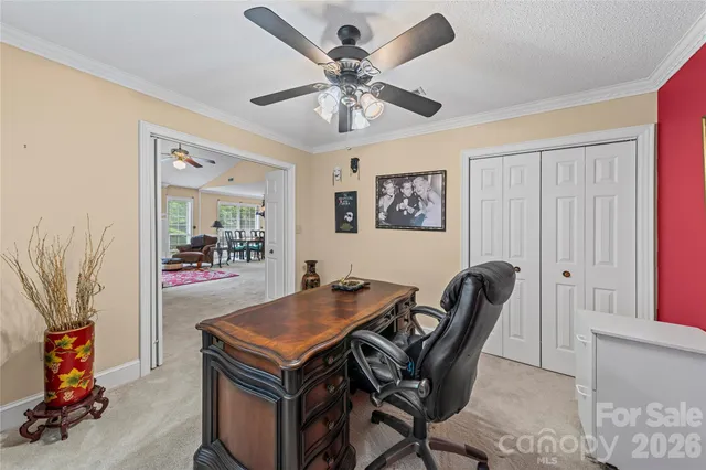 a hallway with sliding door and furniture
