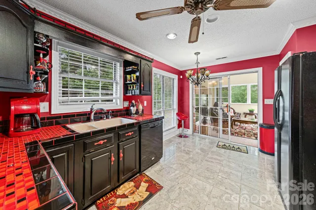 a spacious bathroom with a granite countertop sink a mirror and shower