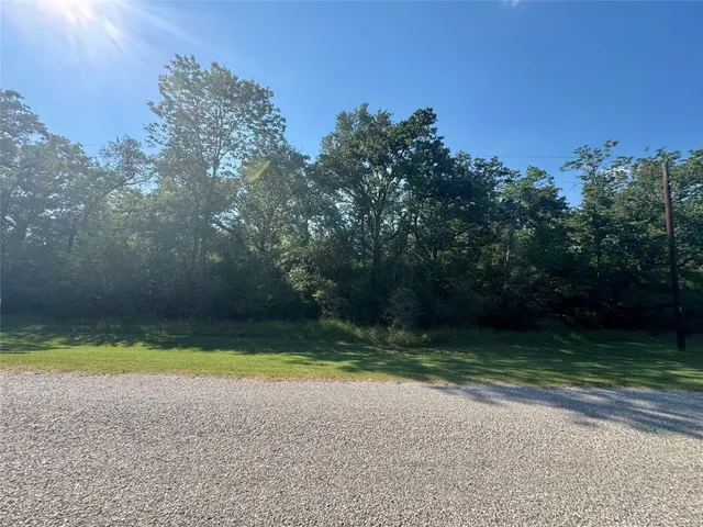 a view of a swimming pool and a yard