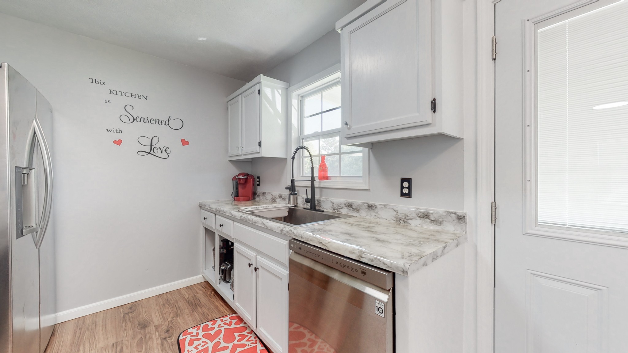 250 Hugh Hunter Road Oak Grove, KY 42262 - Photo 11 of 33 a kitchen with stainless steel appliances granite countertop a sink stove and cabinets