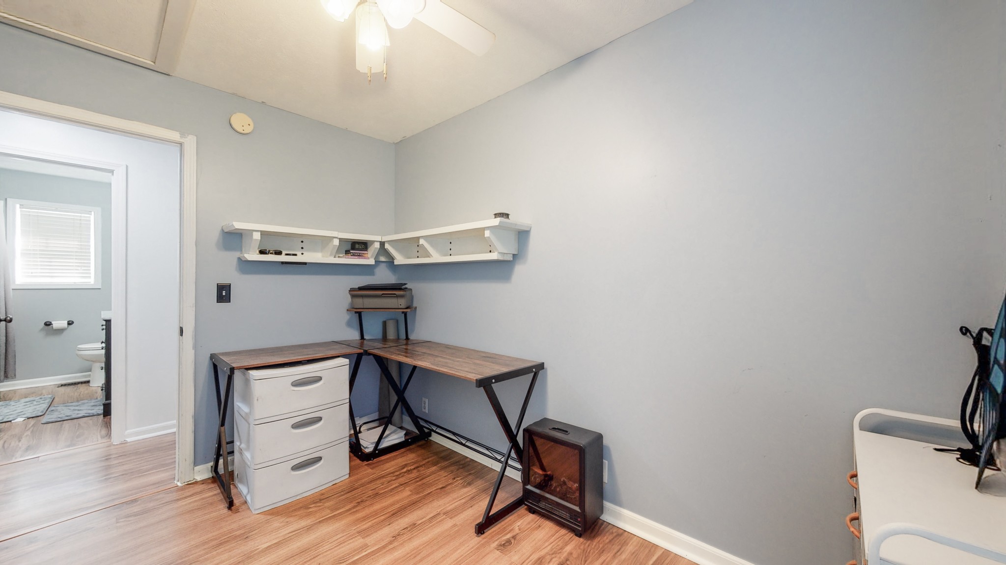 250 Hugh Hunter Road Oak Grove, KY 42262 - Photo 14 of 33 a view of a workspace with furniture and wooden floor