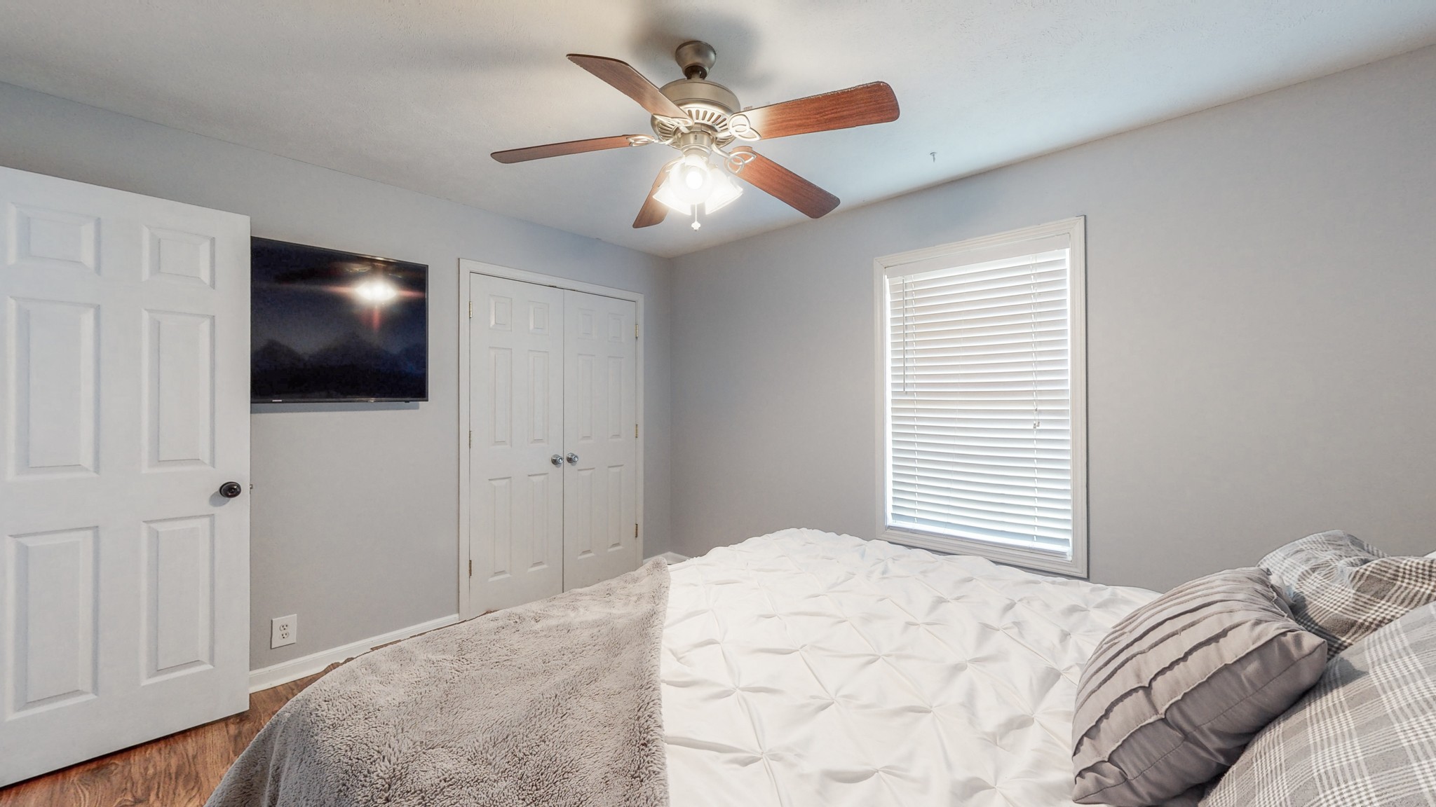 250 Hugh Hunter Road Oak Grove, KY 42262 - Photo 16 of 33 a bedroom with a large bed and a flat screen tv