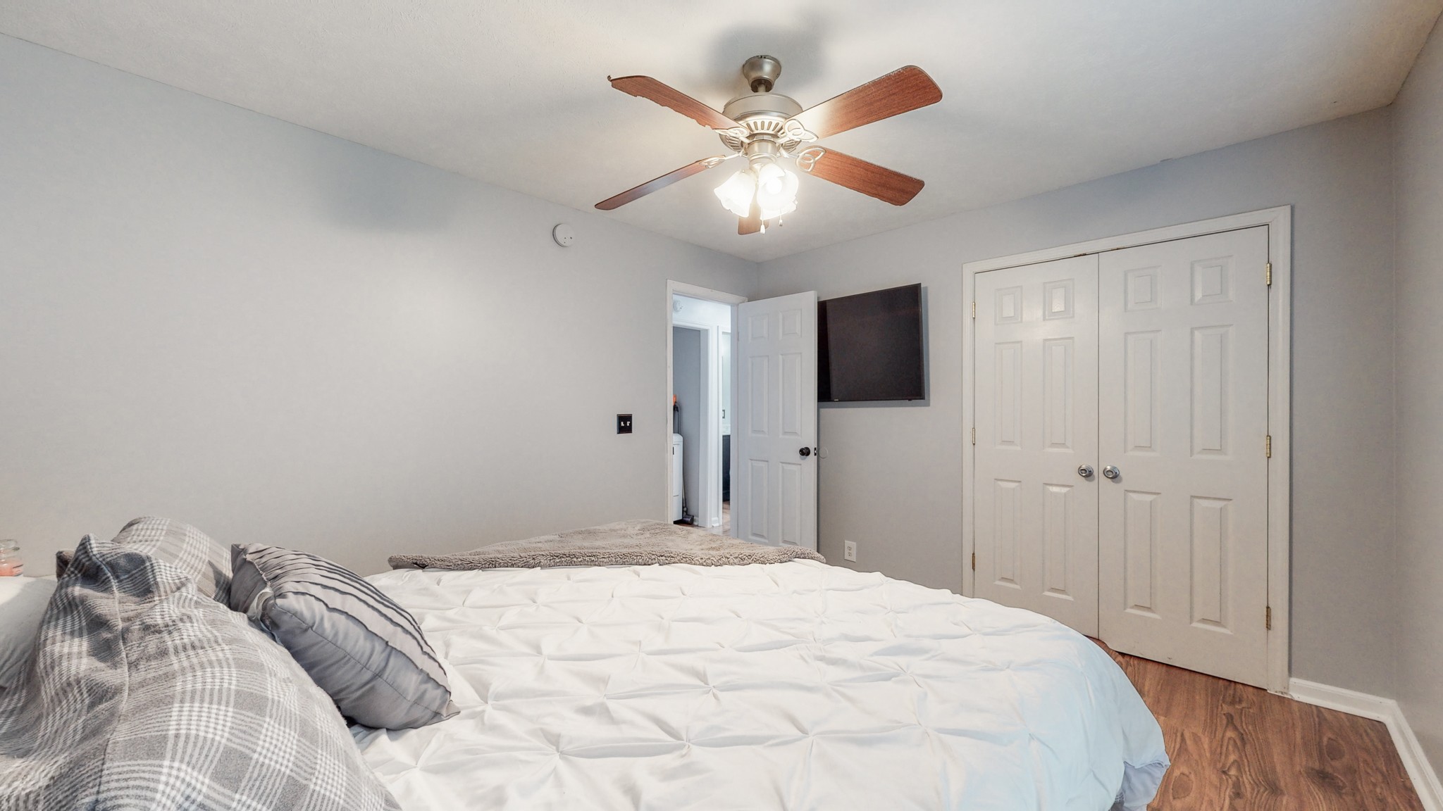 250 Hugh Hunter Road Oak Grove, KY 42262 - Photo 18 of 33 a bedroom with a large bed and a chandelier