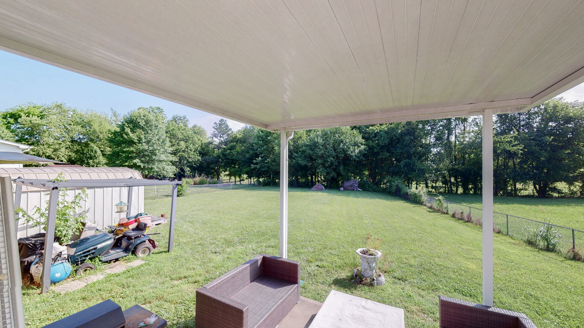 250 Hugh Hunter Road Oak Grove, KY 42262 - Photo 28 of 33 a view of a patio with a table chairs and a yard