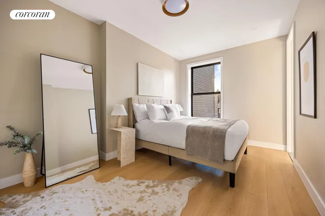 a bedroom with a bed and a dresser