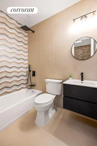 a bathroom with a toilet a sink and bathtub