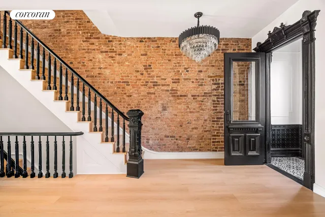 a view of entryway with a front door