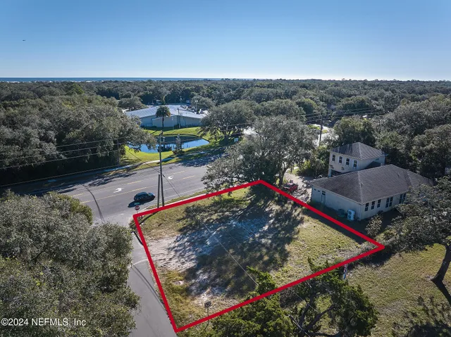 a view of a tennis ground with a mountain view