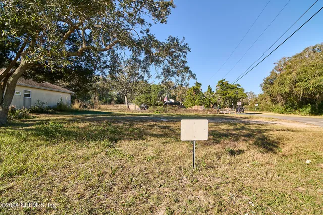 a view of a yard with trees