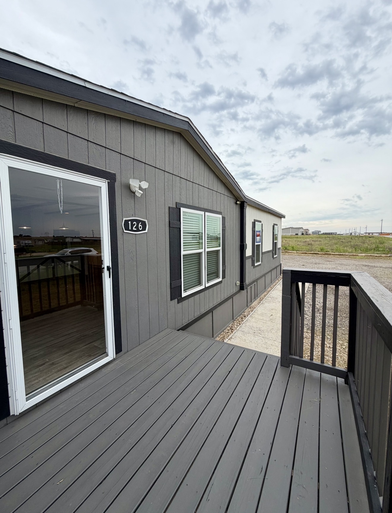 126 Castellana Way Elgin, TX 78621 - Photo 5 of 19 a porch with seating space