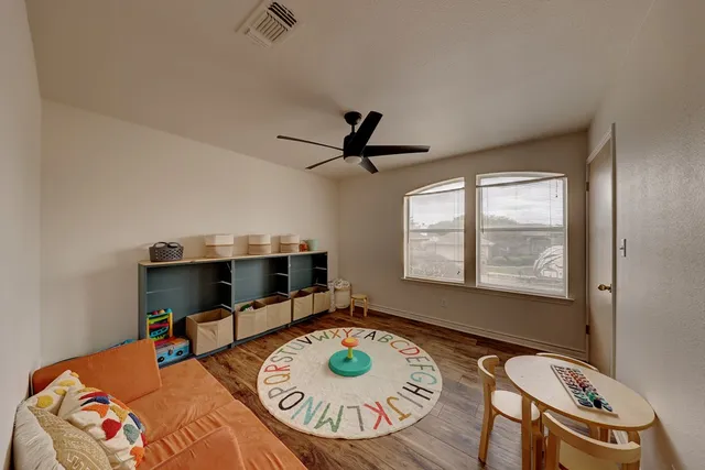 a living room with furniture and a table