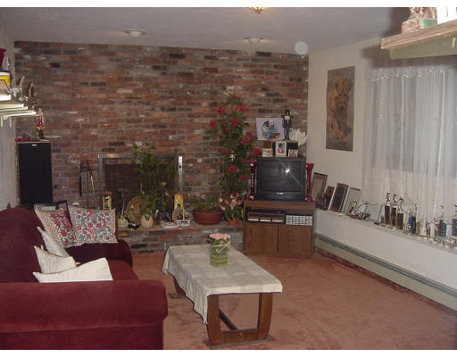17 Mary Chilton Road Needham, MA 02492 - Photo 2 of 7 a living room with furniture and a fireplace