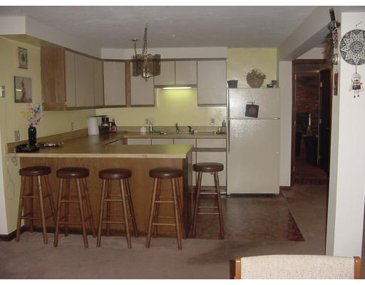 17 Mary Chilton Road Needham, MA 02492 - Photo 5 of 7 a kitchen with a sink cabinets and appliances