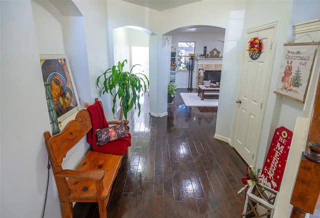 a view of a dining room with furniture and a potted plant