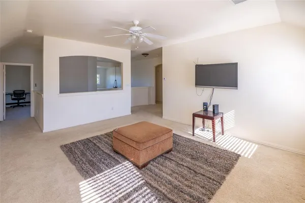 a living room with furniture and a rug