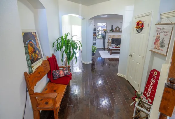 a view of a dining room with furniture and a potted plant
