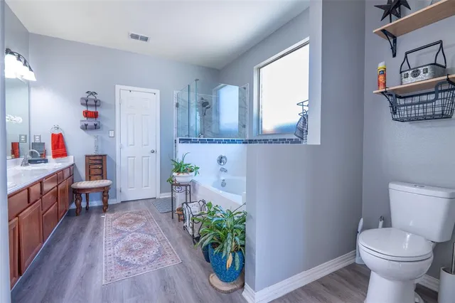 a bathroom with a sink toilet and a mirror