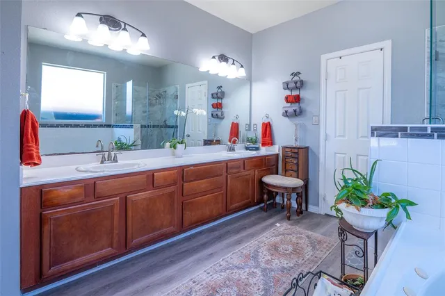 a spacious bathroom with a toilet sink and mirror