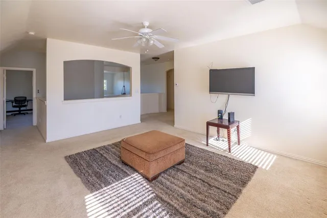a living room with furniture and a rug