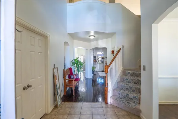 a view of entryway with furniture and stairs