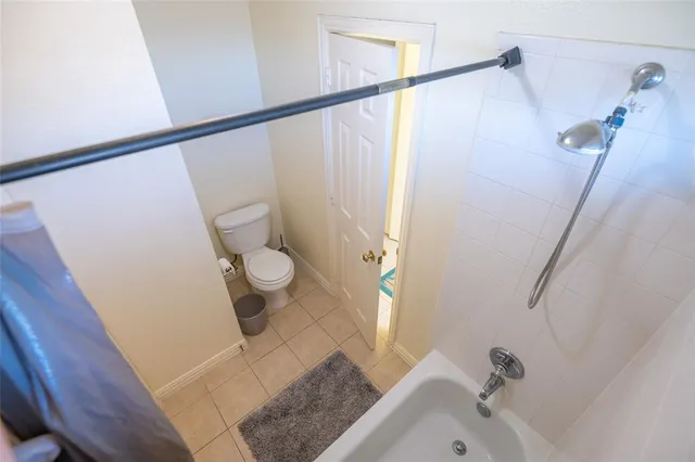 a bedroom with bed and window