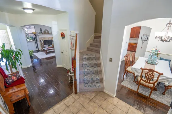 a living room with furniture and a dining table