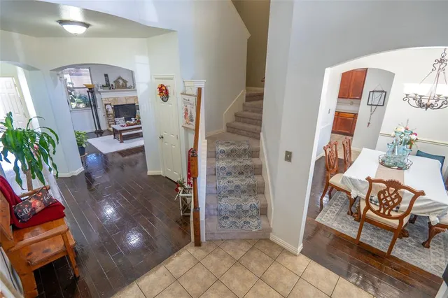 a living room with furniture and a dining table
