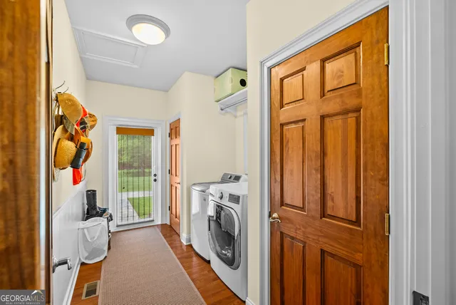 a view of a bedroom with washer and dryer