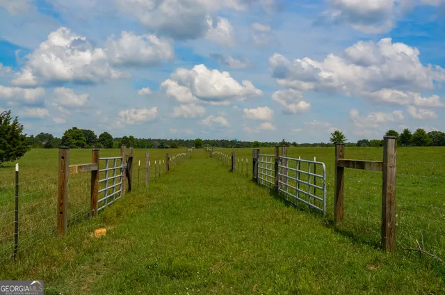 a view of a lake with houses in the back