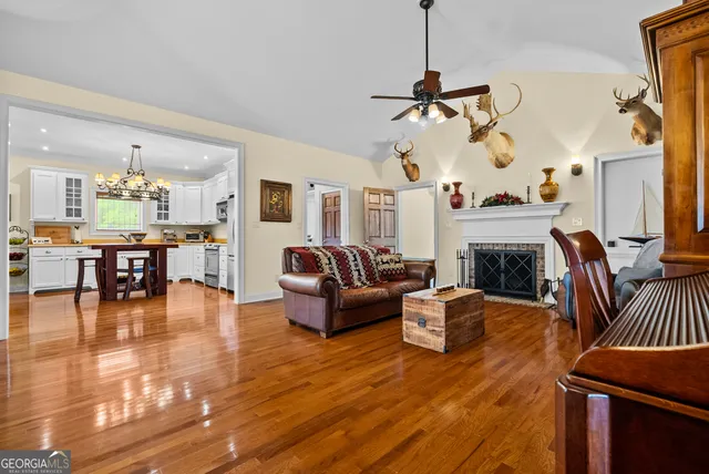 a living room with furniture and fireplace