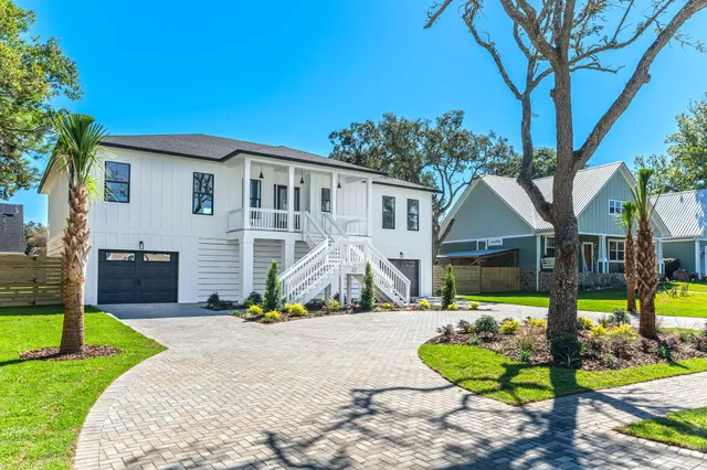 a kitchen with cabinets appliances a sink and a window
