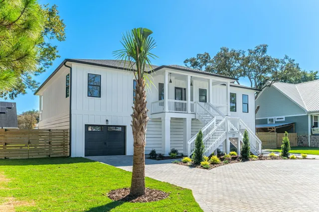 a spacious kitchen with stainless steel appliances a stove sink and refrigerator