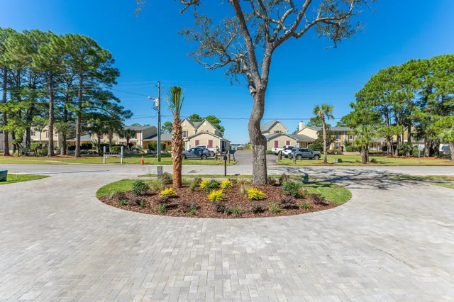 a kitchen with a sink a stove a refrigerator and cabinets